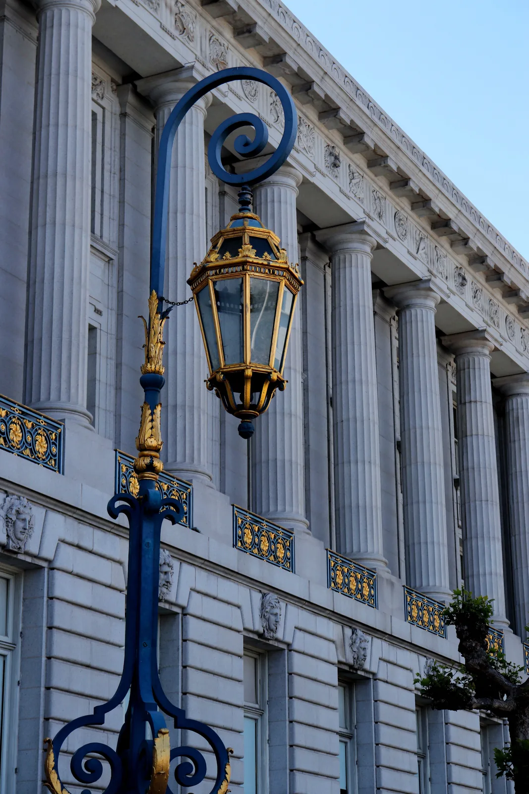Civic building columns and a public street lamp